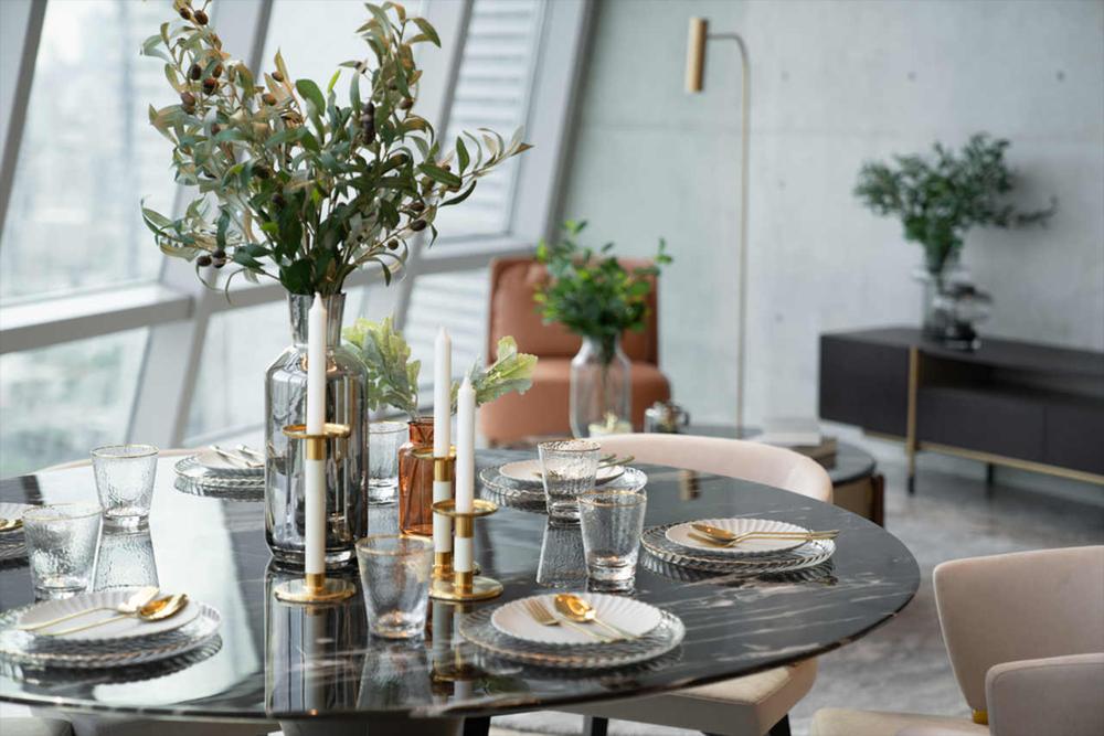 a black marble dining room with gold details