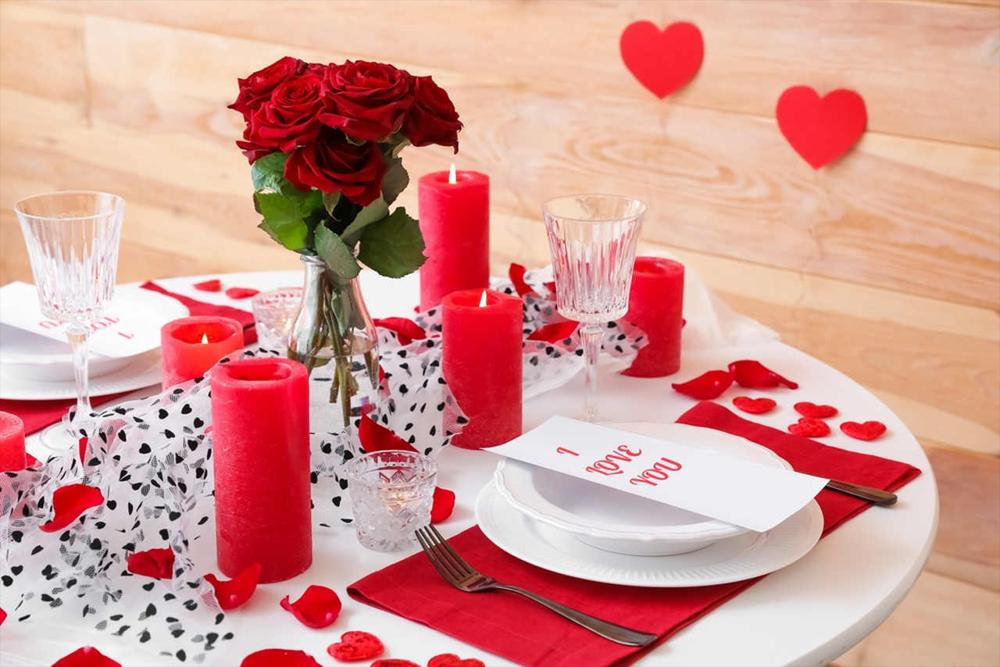 romantic dinner table decoration with red candles