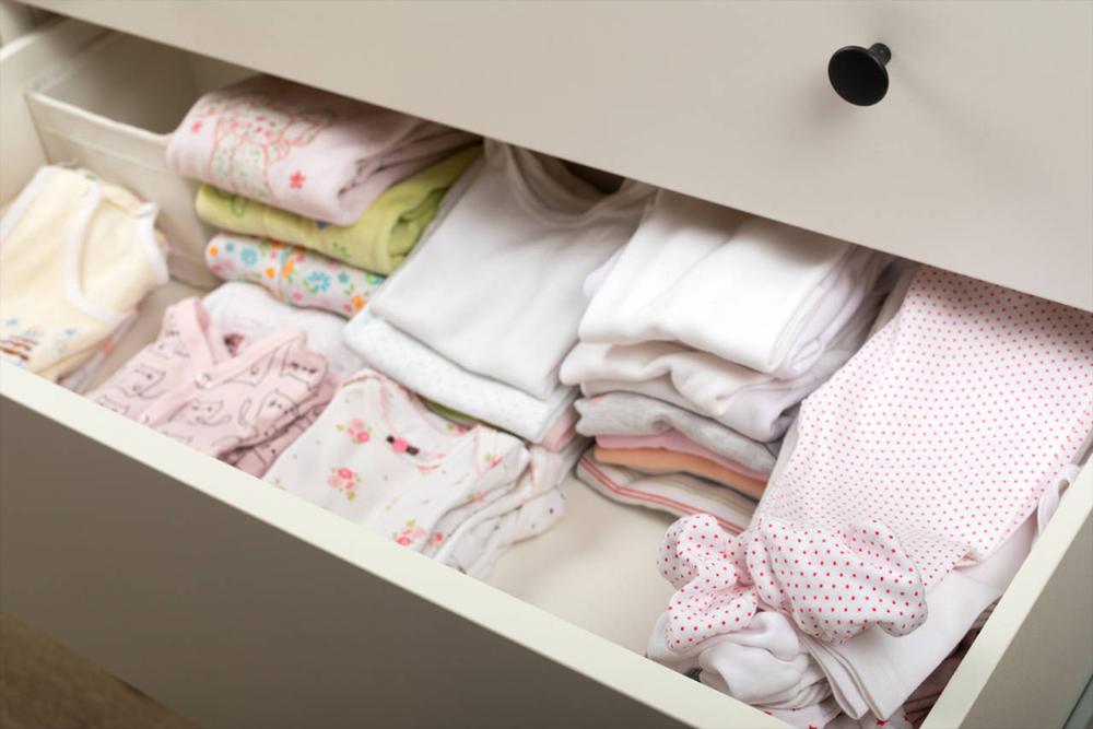 divided clothes in a baby dresser