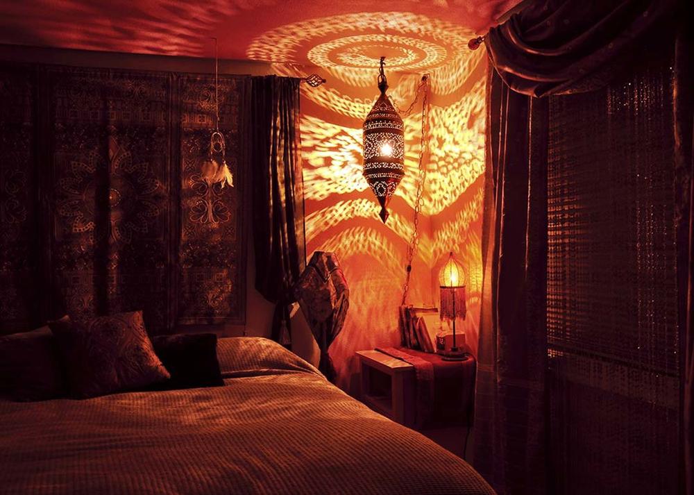 Moroccan bohemian lantern in a dark bedroom