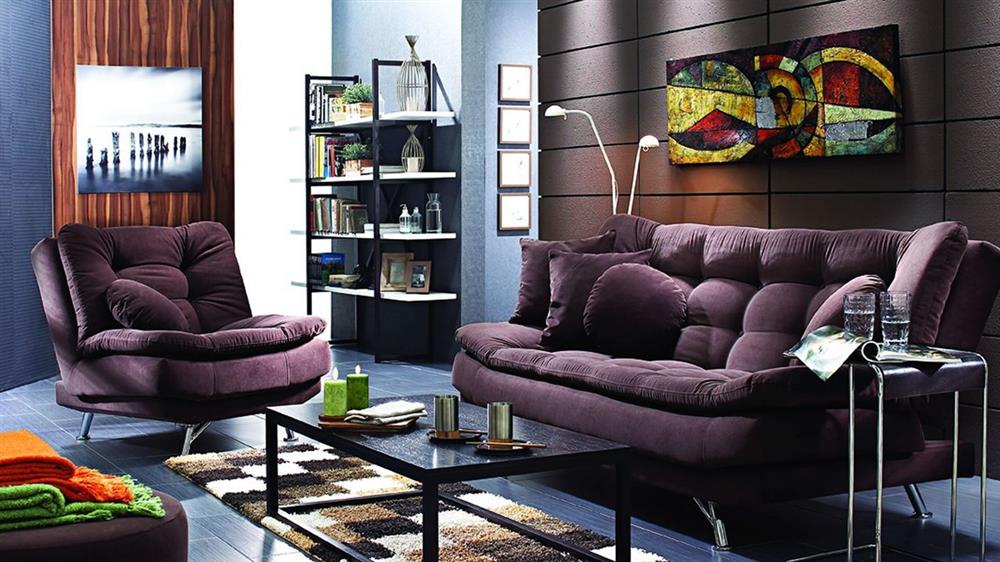 cozy living room that has a purple colored sofa set
